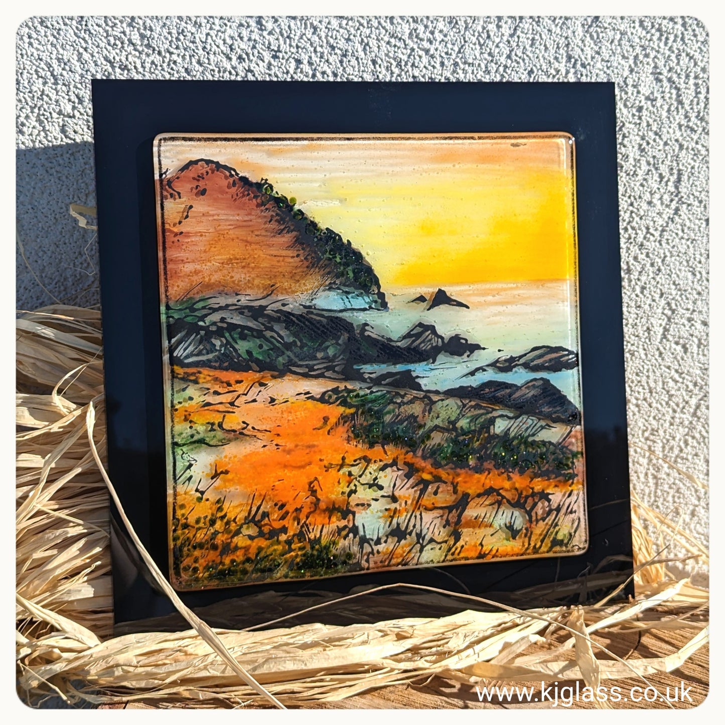 Fused glass art piece, hand drawn coastal image with autumnal colours.