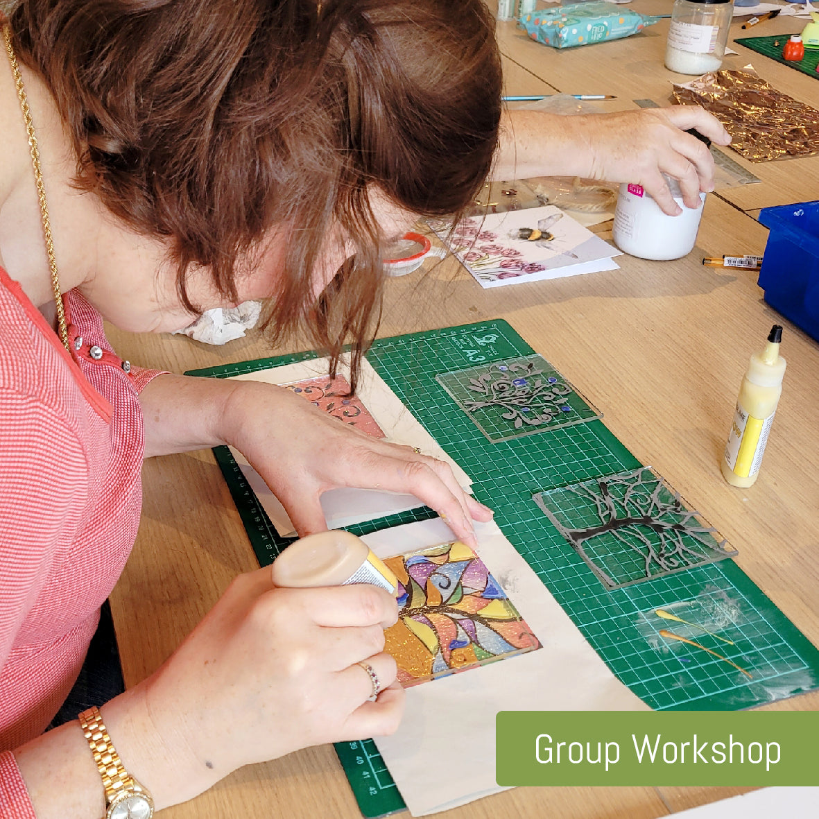 Customer creating fused glass in a group workshop